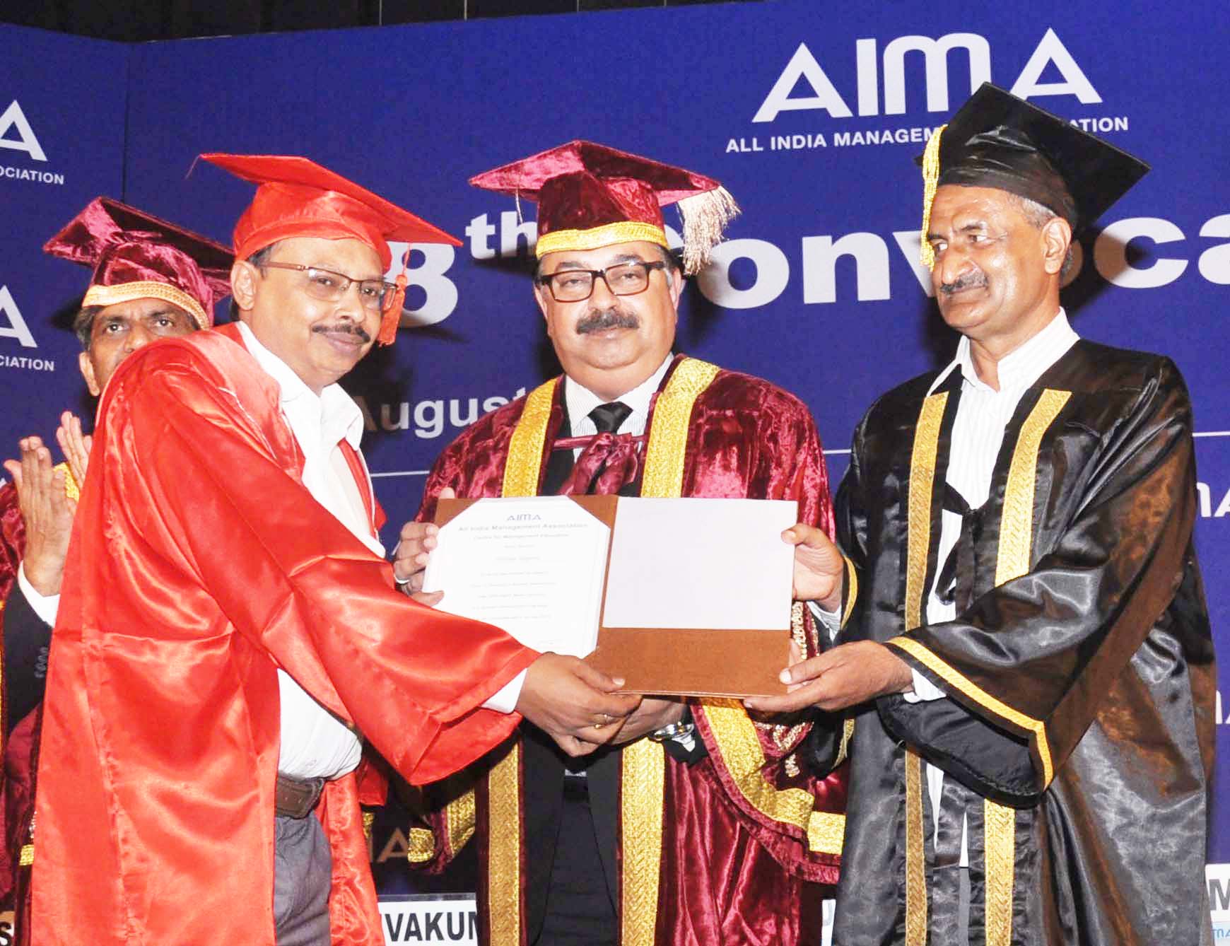 Alekhya Talapatra receiving Doctorate from Sudhir Vasudeva, Chief Managing Director, ONGC