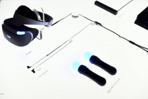 Components of Sony's PlayStation VR, including Playstation Move motion controllers at bottom right, are displayed during an event in San Francisco